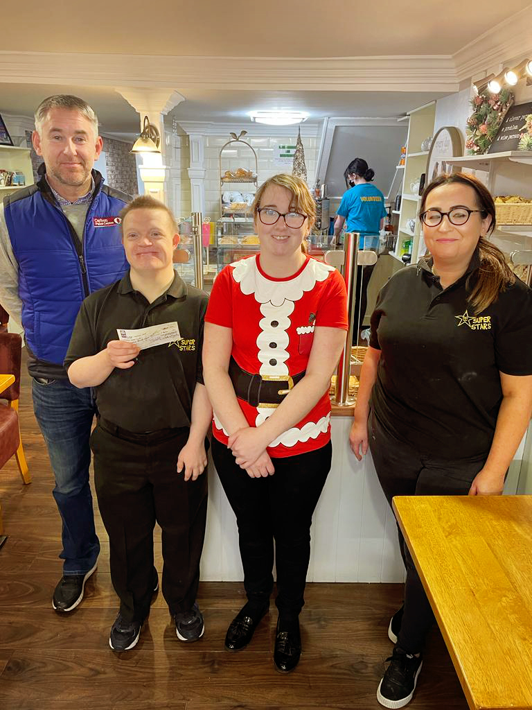 Fintan Loughran, Carbon Paint Centre, presents Carbon Group's charity donation to Superstars Club, Cookstown, Co. Tyrone