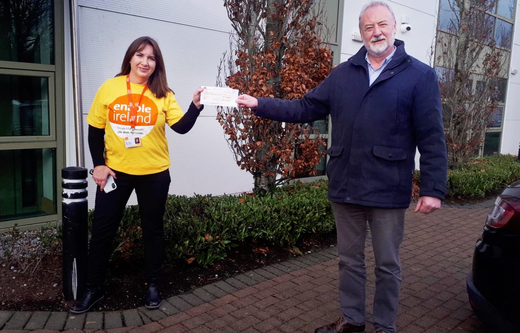 Presentation of cheque by Art Graham, Quality Manager, Carbon Group, to Maria Desmond, Regional Fundraising Manager, Enable Ireland, at their offices in Little Island, Co. Cork on 9th December, 2021
